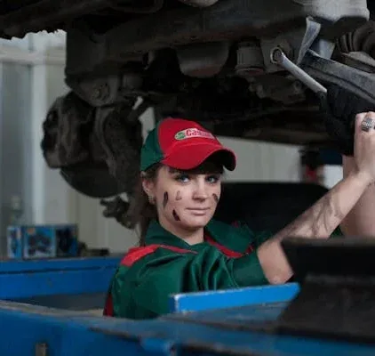 Mechanic working underneath a vehicle